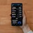 A hand holds a smartphone displaying a cryptocurrency portfolio with various assets including Decentraland, Ethereum, Bitcoin, Algorand, and Polygon. The balance for each asset is shown alongside icons representing each cryptocurrency.